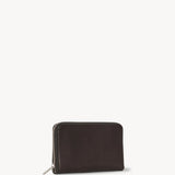 Side slanted view of dark brown large zip wallet on white background, with no model shown.