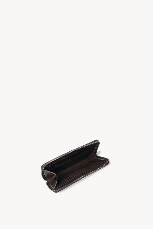 Zipper open view of dark brown of large zip wallet on white background with no model shown.
