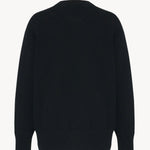 Back view of black leilani top on white background, with no model shown.