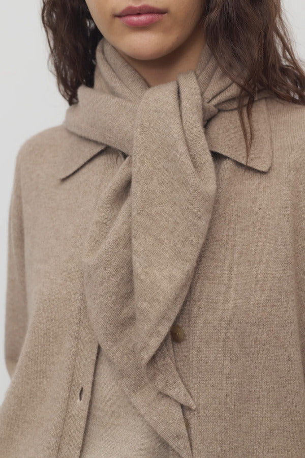 Front view of Taupe Leomine Scarf on model wearing Taupe sweater, against white background.