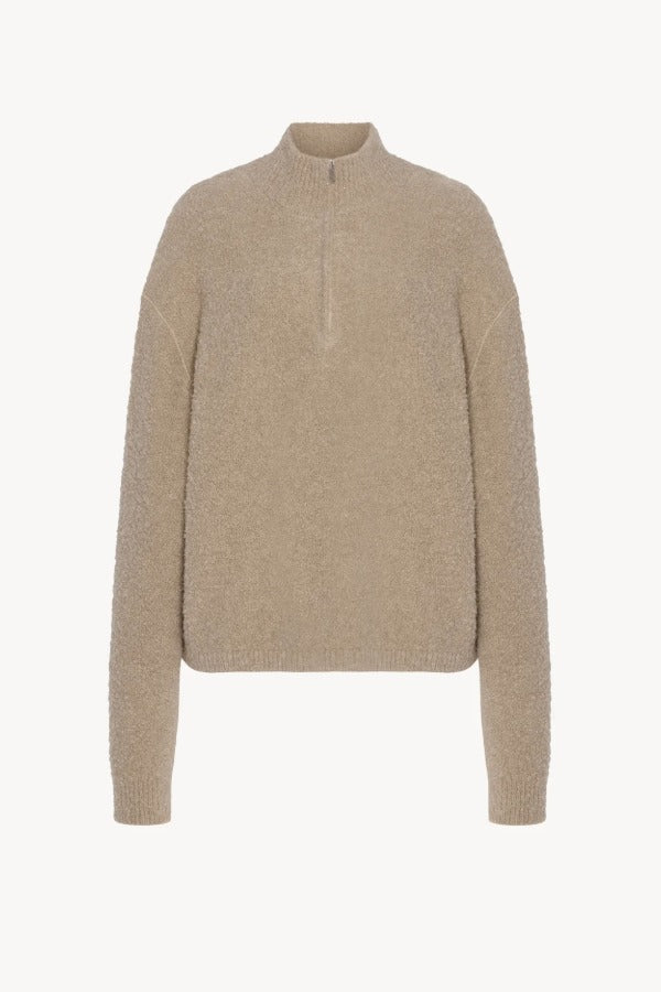 Front view of beige lethara sweater on white background, with no model shown.