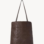 Back view of brown lilou woven tote on white background, with no model shown.