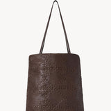 Back view of brown lilou woven tote on white background, with no model shown.