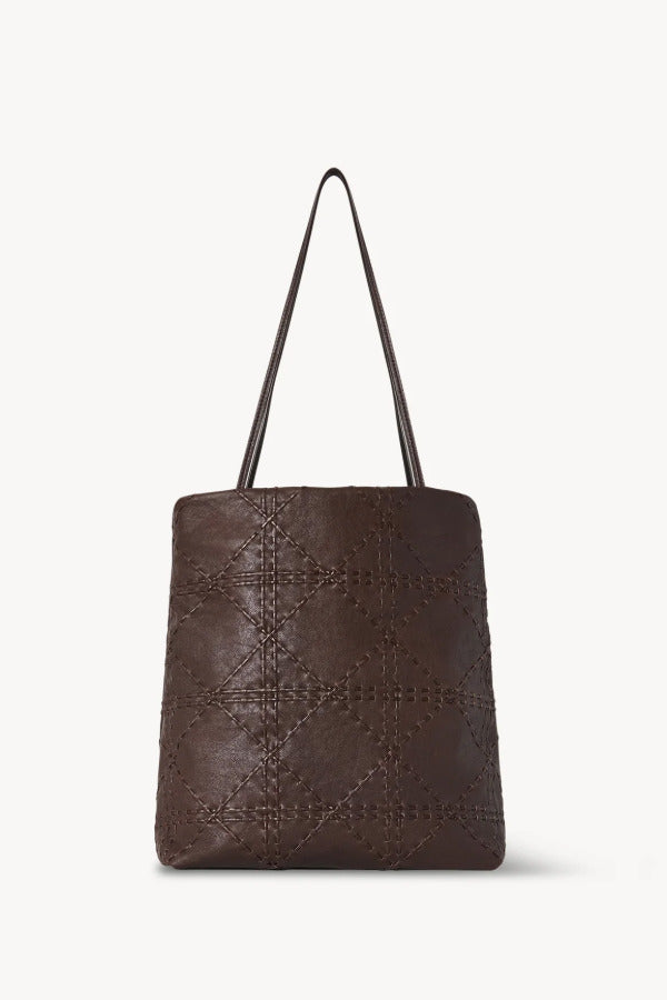 Back view of brown lilou woven tote on white background, with no model shown.