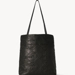 Front view of black lilou woven tote on white background, with no model shown.