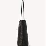 Side view of black lilou woven tote on white background, with no model shown.