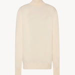 Front view of ivory lizzy top on white background, with no model shown.