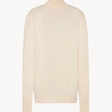 Front view of ivory lizzy top on white background, with no model shown.