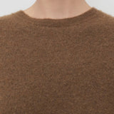 Front closeup of oak lorynna top on model against a white background.