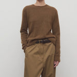 Front view of oak lorynna top on model wearing camel trousers and brown belt, against a white background.