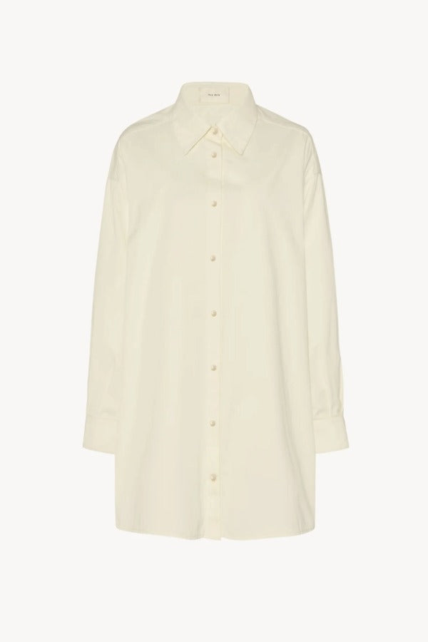 Front view of white luka shirt on white background, with no model shown.