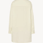 Back view of white luka shirt on white background, with no model shown.