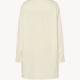 Back view of white luka shirt on white background, with no model shown.
