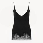 Front view of black makka top on white background, with no model shown.