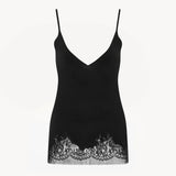 Front view of black makka top on white background, with no model shown.