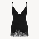 Back view of black makka top on white background, with no model shown.