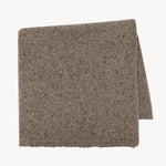 Folded view of sepia mantia scarf on white background, with no model shown.