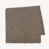 Folded view of sepia mantia scarf on white background, with no model shown.