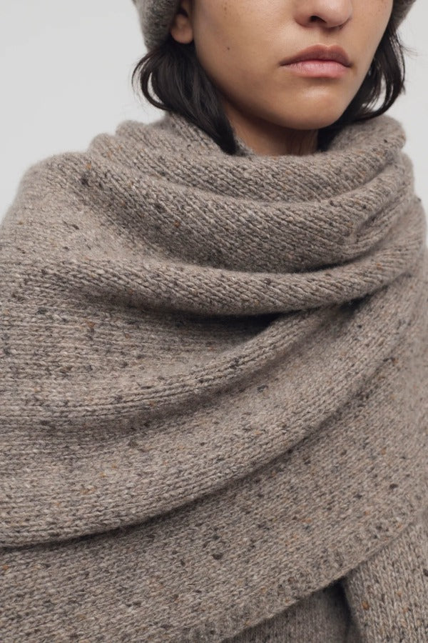 Front view of sepia mantia scarf on model, against a white background.
