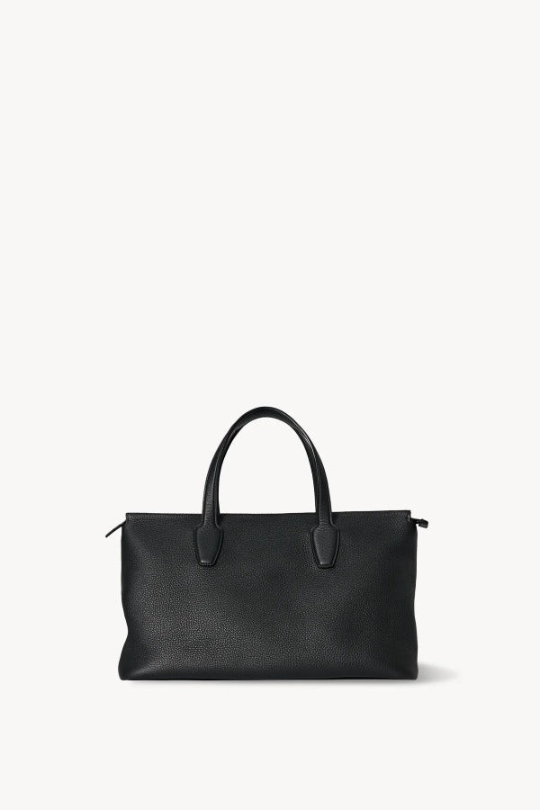 Front view of black marcel bag on white background, with no model shown.