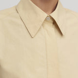 Front closeup view of sand margan shirt on model, against a white background.