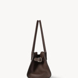 Side view of deep brown margaux shoulder 12 bag on white background, with no model shown.