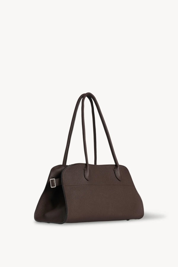 Front slanted view of deep brown margaux shoulder 12 bag on white background, with no model shown.