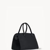 Side view of the Margaux 10 bag on white background, no model shown