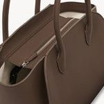 Zipper view of dark olive marlo 12 bag on white background, with no model shown.