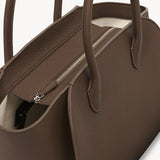 Zipper view of dark olive marlo 12 bag on white background, with no model shown.