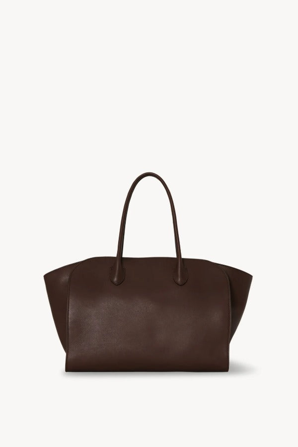 Front view of deep brown marlo 14 bag on white background, with no model shown. 