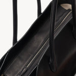 Zipper view of black marlo 14 bag on white background, with no model shown.