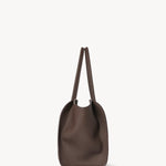 Side view of deep brown marlo 14 bag on white background, with no model shown.