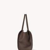 Side view of deep brown marlo 14 bag on white background, with no model shown.