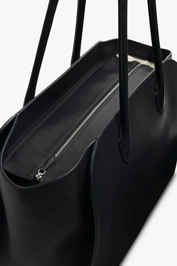 Zipper view of black marlo 17 bag on white background, with no model shown.