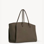 Front slanted view of taupe marlo 17 bag on white background, with no model shown.