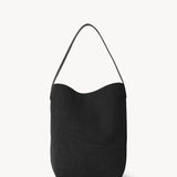 Front view of black medium n/s park tote on white background, with no model shown.