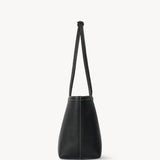 Side view of black medium park tote on white background, with no model shown.