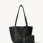 Front view of black medium park tote with zipper pouch on white background, with no model shown.