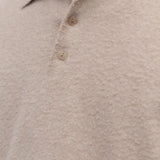 Front closeup view of beige melange almot sweater on model, against a white background.