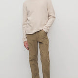 Front view of beige fred pant on model wearing oatmeal top and slides, against a white background.
