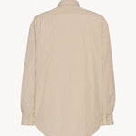 Back view of ivory/beige granada shirt on white background, with no model shown.