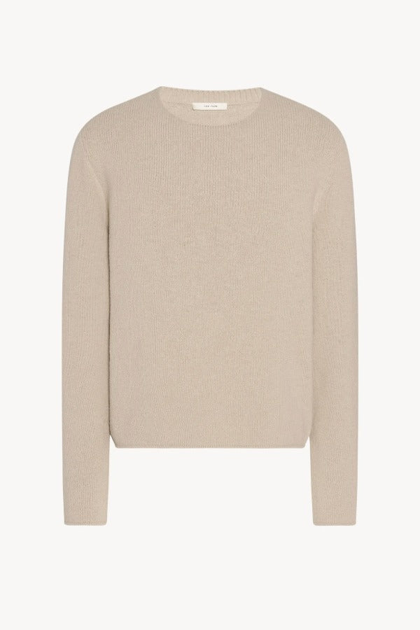 Front view of ecru nikola sweater on white background, with no model shown.