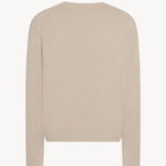 Back view of ecru nikola sweater on white background, with no model shown.