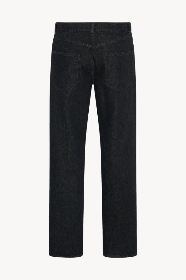 Back view of indigo rossen jean on white background, with no model shown.