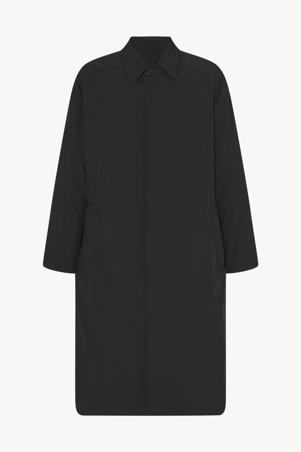 Alternate front view of black tarian coat on white background, with no model shown.