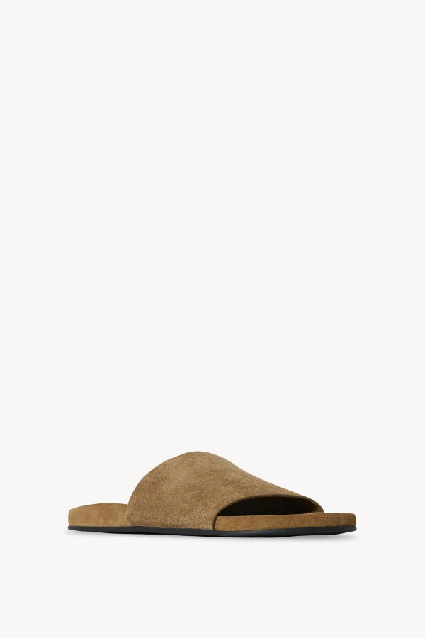 Front slanted view of military hugh slide sandal on white background, with no model shown.