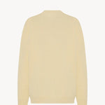 Back view of yellow migeia top on white background, with no model shown.