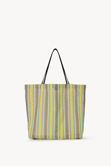 Front view of mesh and leather bag on white background, with no model shown.