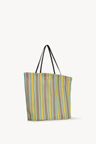 Side slanted view of mesh and leather bag on white background, with no model shown.